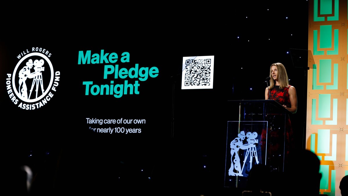 Executive Director of the Will Rogers Foundation, Christina Blumer, speaking at the dinner