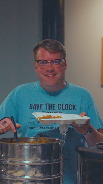 A member of DMS staff enjoying Munch of the Month